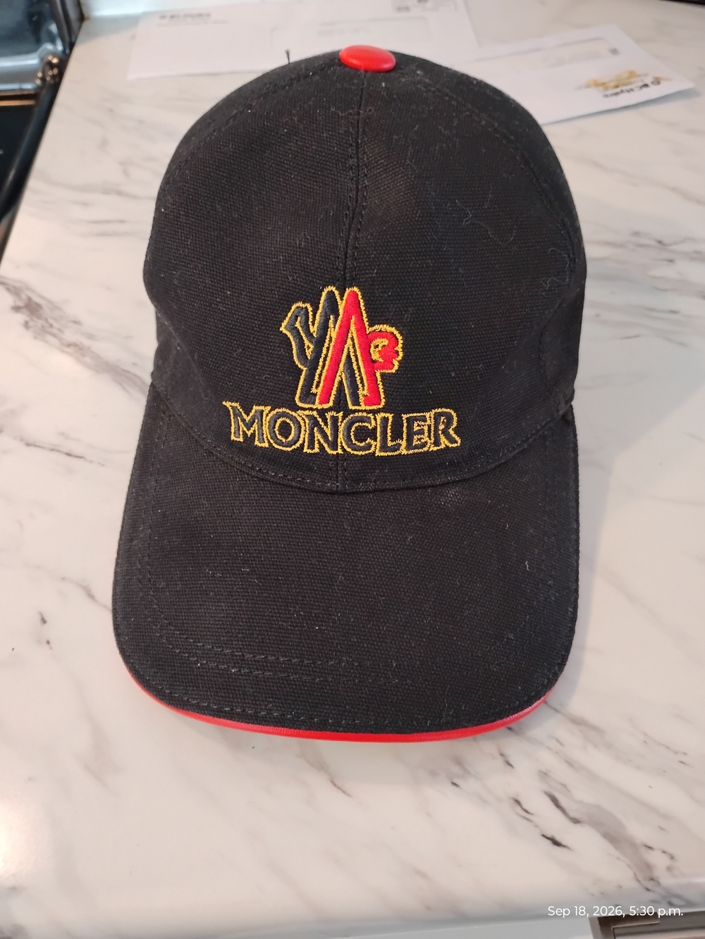 Moncler Black Cap with Red & Yellow Embroidered Logo